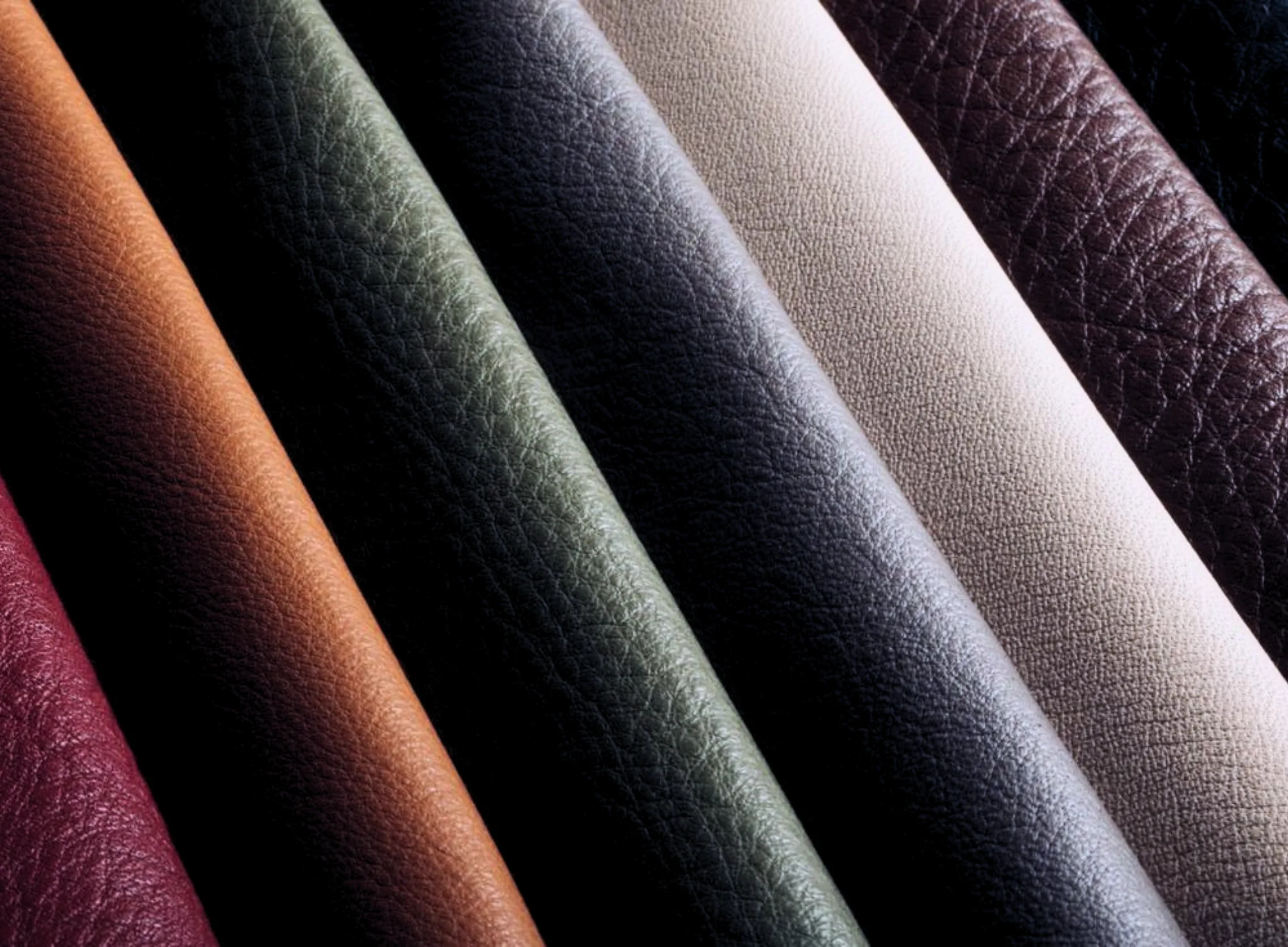 Close-up of stacked leather swatches in a range of colours.